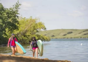 Two paddleboarders on Blackstrap Lake Saskatchewan
