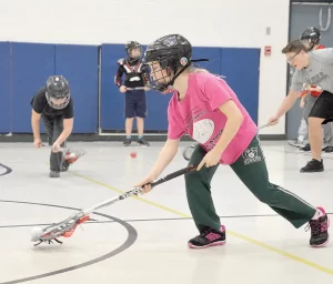 Kids playing lacrosse at Dundurn School in Saskatchewan